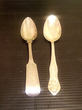 Pair of Silver-Tone Serving Spoons with Decorative and Plain Handles